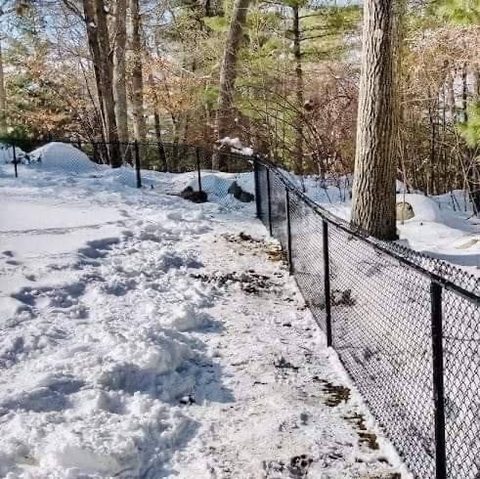 Chain link fence installed through winter ground conditions